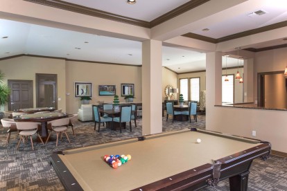 Game lounge with billiards at Camden Greenway Apartments in Houston, TX