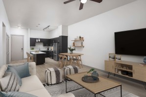 Modern style living room and kitchen with wood-style floors throughout at Camden Belmont apartments in Dallas, Tx