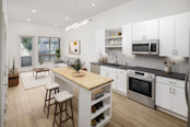 camden-loso-apartments-charlotte-nc-modern-white-kitchen-builtins