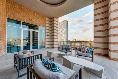 Rooftop outdoor lounge with seating and skyline views