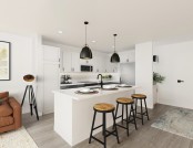 Modern style kitchen with white upper cabinets, gray bottom cabinets, white countertops and matte black accents at Camden Village District in Raleigh, NC