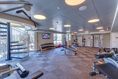 24 hour fitness center with weight machines and free weights