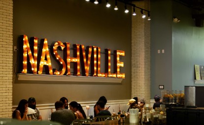 Local restaurant Biscuit Love with Nashville sign.