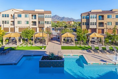 Resort style swimming pool with cabanas and lounging areas