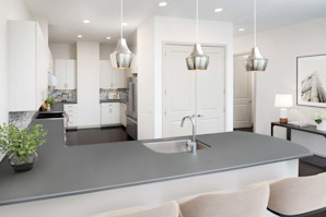 Penthouse kitchen with Viking appliances, spacious quartz countertop, and double-door pantry at Camden Music Row apartments in Nashville, TN