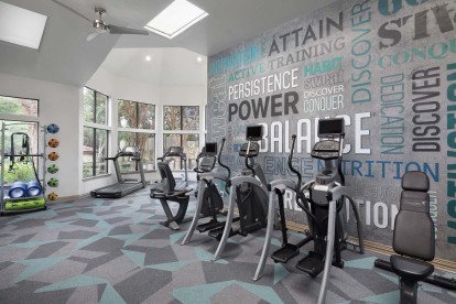 24-hour fitness center with cardio and strength equipment at Camden Gaines Ranch in Austin, TX