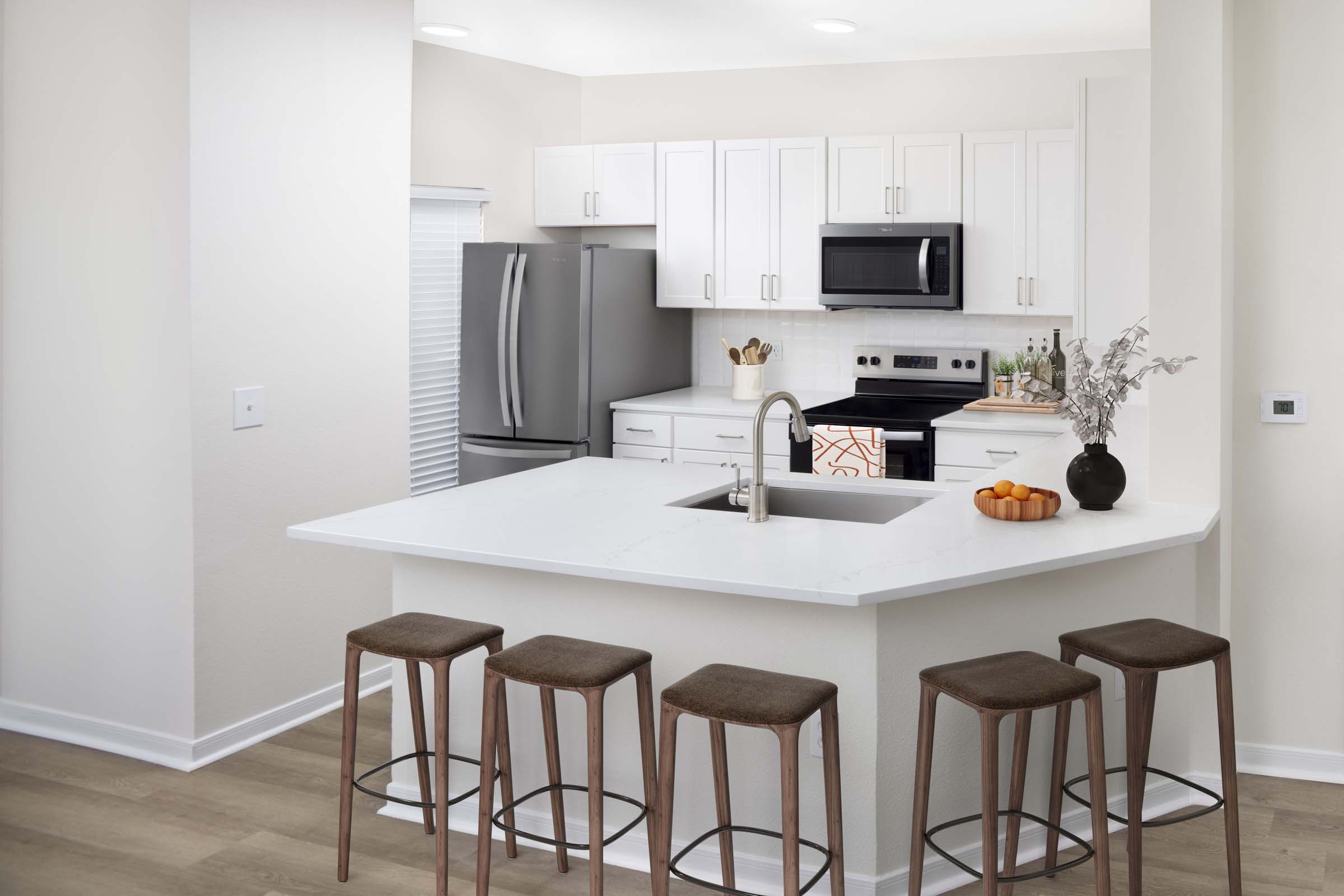 Townhome kitchen in our contemporary style with all stainless steel appliances at Camden Overlook Apartments in Raleigh, NC. 