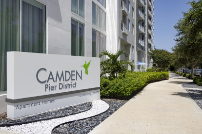 Monument sign outside community at Camden Pier District apartments in St. Petersburg, Florida.