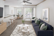 Camden Greenway apartment homes in Houston, TX living room and dining room with plush carpet and lighted ceiling fan