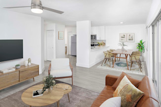Living room with wood-inspired flooring in the Alberti floorplan at Camden Portofino in Pembroke Pines, FL.