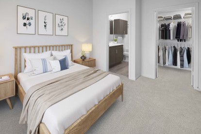 Bedroom with plush carpet, walk-in closet and ensuite