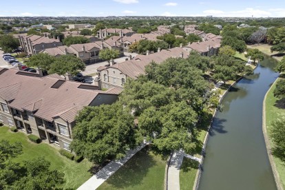 Aerial view of the canal bordering Camden Cimarron apartments in Irving, TX