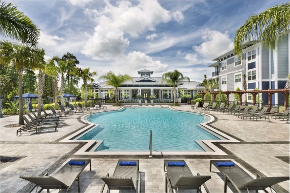 Tropical pool with cabanas and grill pavilion