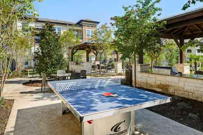 Outdoor Lounge with ping pong and grill area