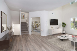 Townhome living room near entryway and home office 