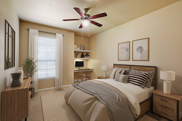 Bedroom with built-in desk and ceiling fan at Camden Brushy Creek apartments in Cedar Park, TX