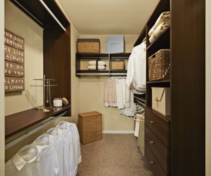 Spacious walk in closet with storage