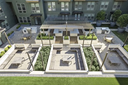 Aerial view of outdoor courtyard with seating and grill area at Camden Greenville