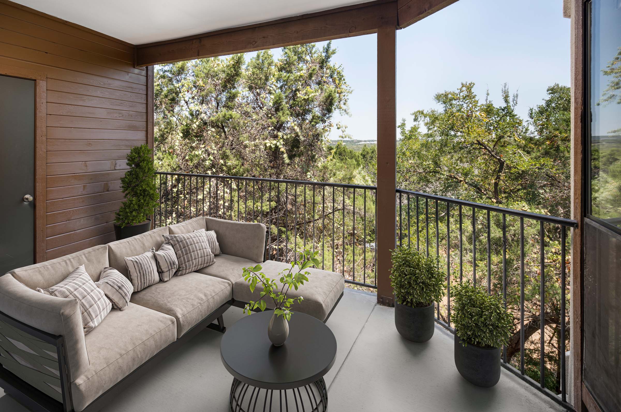 Large private balcony overlooking greenspace at Camden Gaines Ranch apartments in Austin, TX