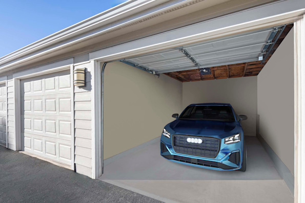 Camden Caley detached garage bay with garage open and vehicle parked 