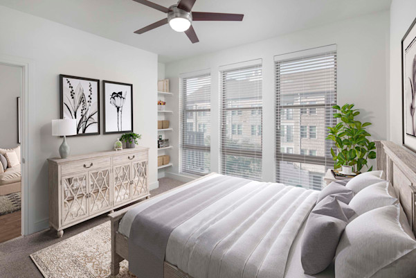Flats bedroom with carpet and built-in shelves at Camden Greenville