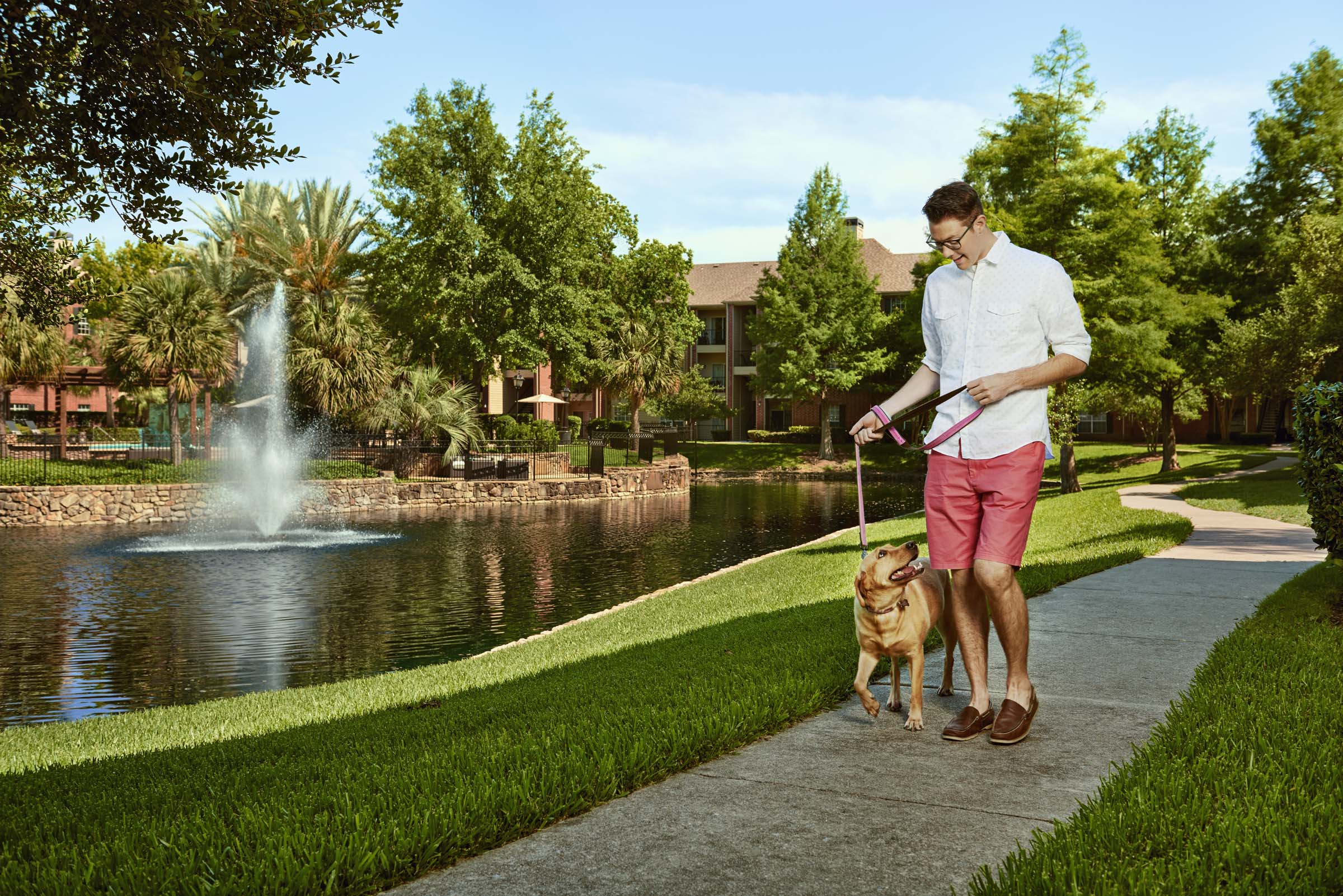 Pet friendly with private lake and walking trail at Camden Holly Springs Apartments in Houston, TX