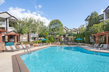 Camden Asbury Village Apartments Raleigh NC Pool with Fireplace and Lounge Seating