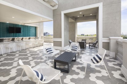 Sky Lounge with Outdoor Kitchen in the Terrace Building at Camden Highland Village apartments and townhomes in Houston, Texas