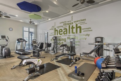 Fitness center with free weights and cardio equipment