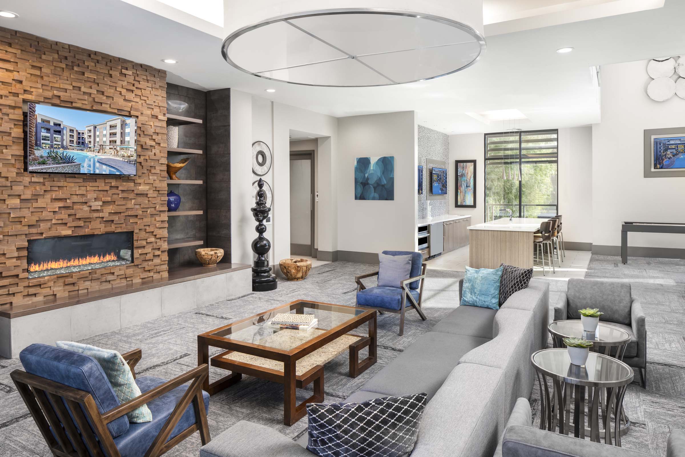 Camden Tempe Apartments Tempe Arizona Resident Lounge with Seating Area, Fireplace, and Catering Kitchen with TV 