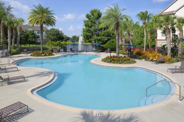 Swimming pool with sundeck, hot tub, and grilling stations