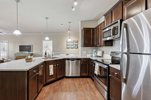 Kitchen with espresso cabinets and stainless steel appliances at Camden Franklin apartments in Franklin, TN