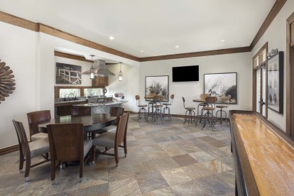 Resident clubhouse with shuffle board and kitchen at Camden Cedar Hills