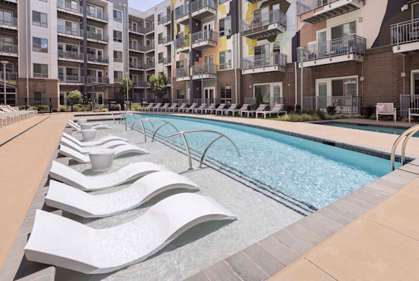 Enjoy Camden LoSo's stunning pool deck with hot tub, grilling area, pizza oven, and a one-of-a-kind hand-painted mural.