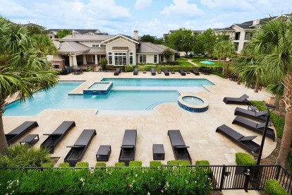 Resort style pool with lounge chairs