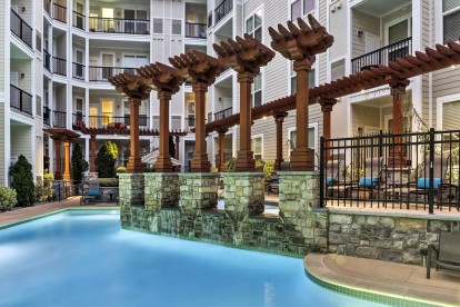 Large resort style outdoor pool dusk