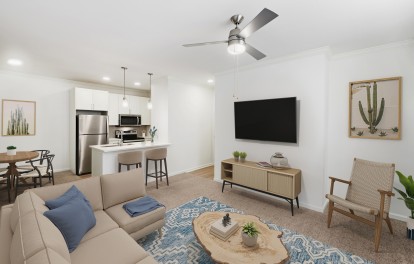 Renovated first floor living room and kitchen at Camden Stoneleigh apartments in Austin, Tx