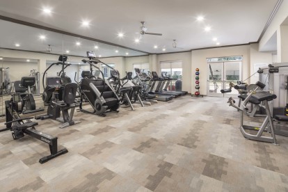 Fitness center with cardio equipment at Camden Plaza Apartments in Houston, TX 
