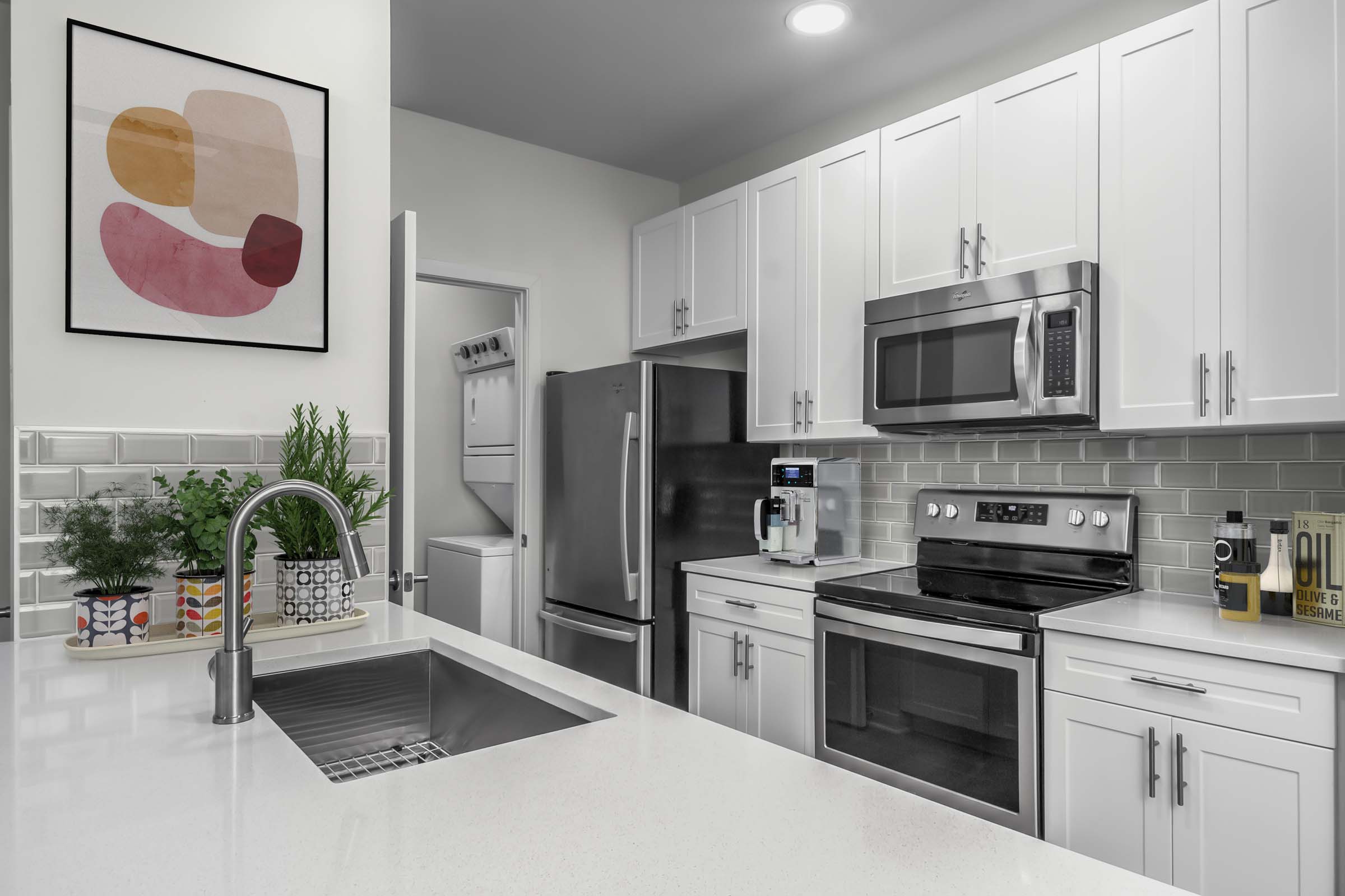 Kitchen with white quartz countertops