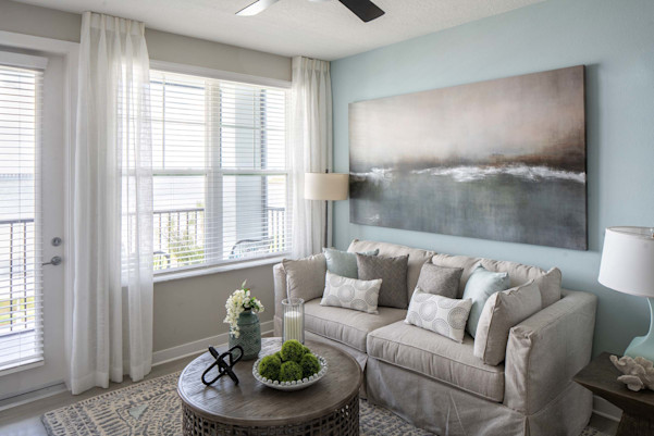 Living room with private balcony at Camden Clearwater apartments in Clearwater, FL