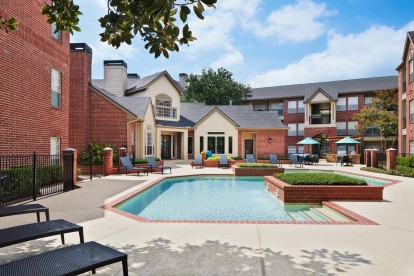 Pool with lounge chairs at Camden Stonebridge Apartments in Houston, TX