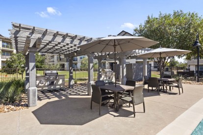 Poolside grills and covered seating at Camden Cedar Hills