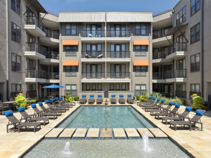 Resort-style pool and sundeck at Camden Belmont apartments in Dallas, TX