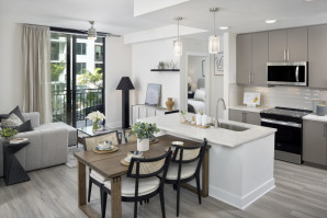 Kitchen, dining, and living room at Camden Atlantic apartments in Plantation, Florida.