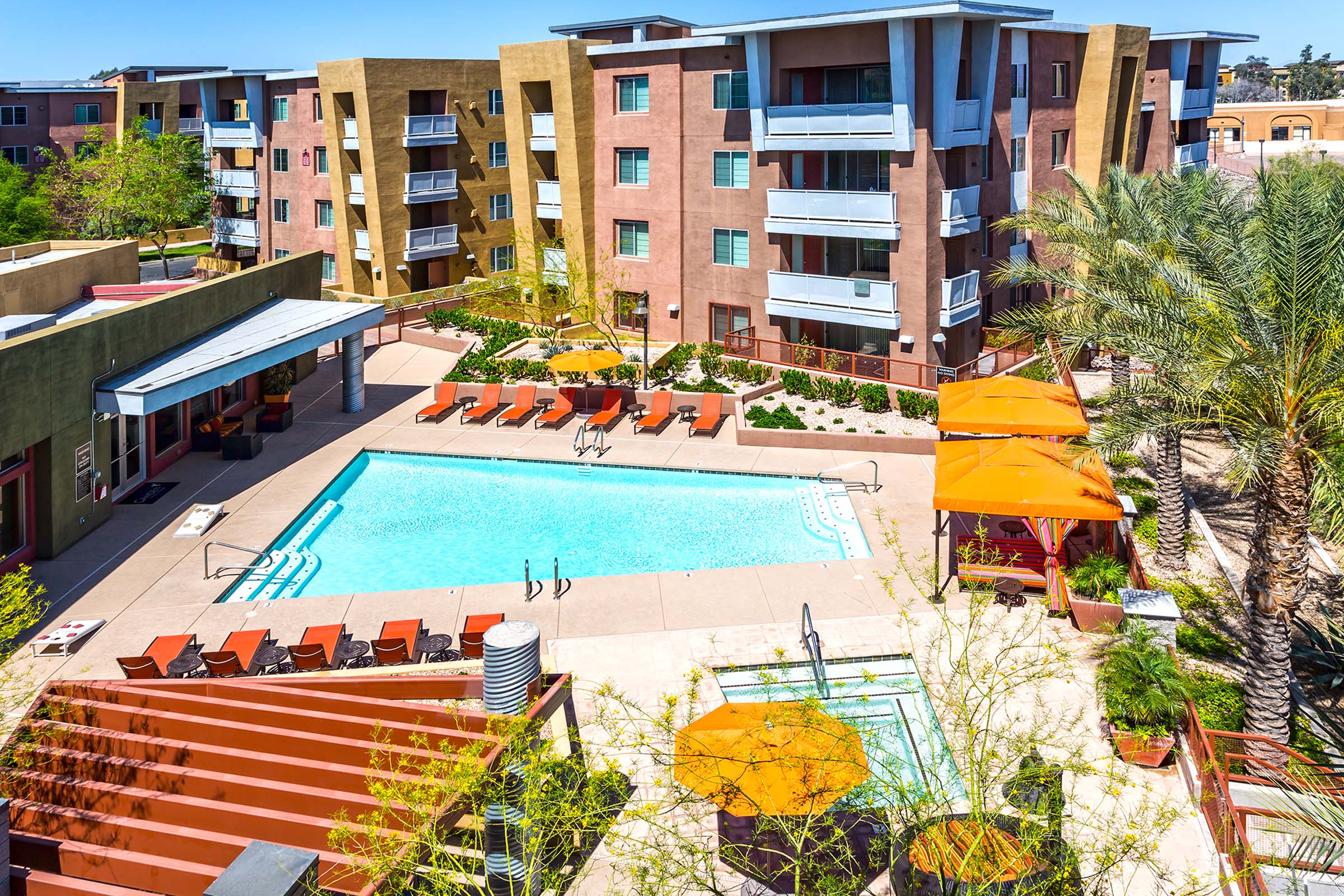 Resort style swimming pool and spa with sundeck and cabanas