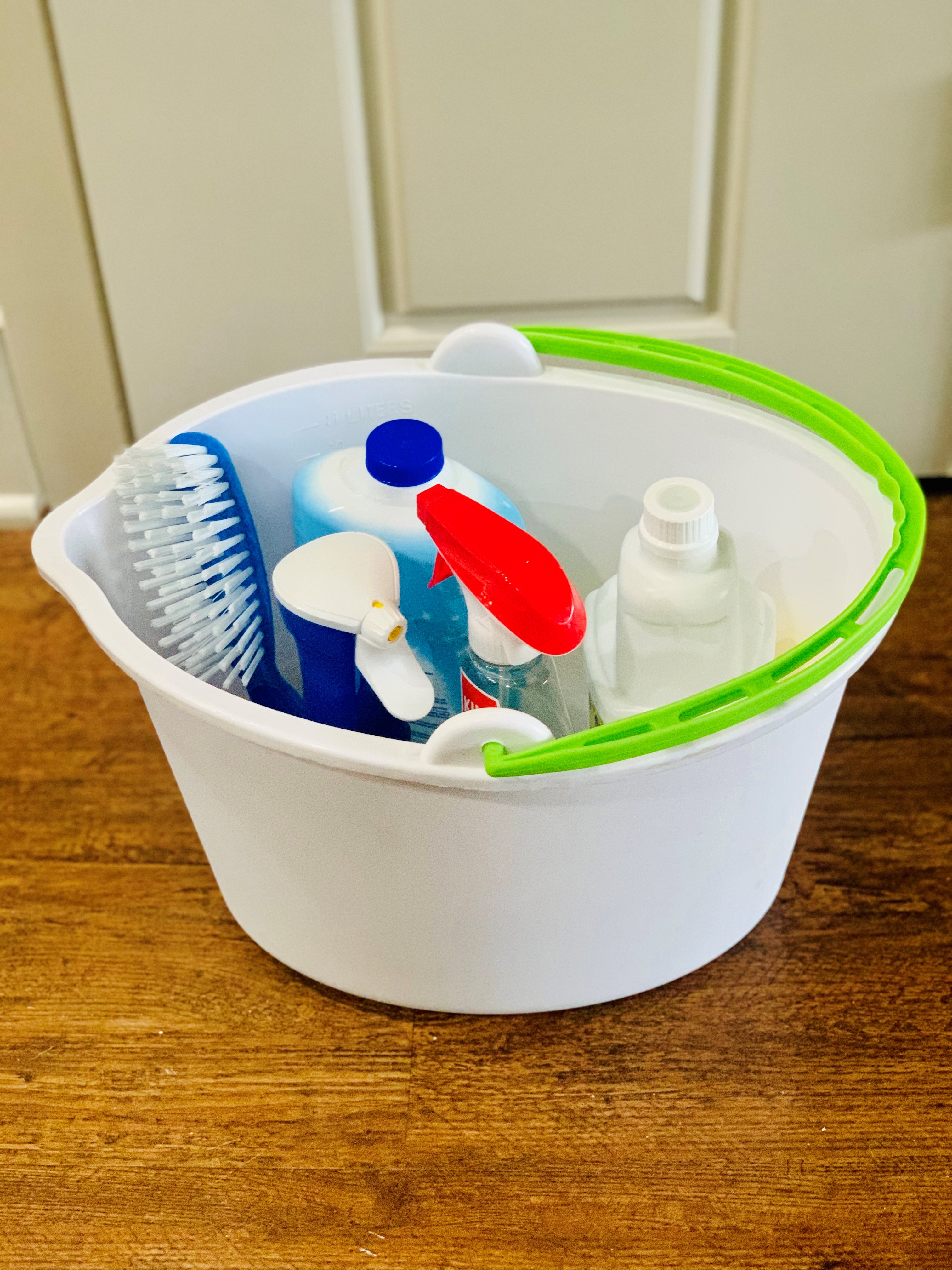 Cleaning products stored in a mop bucket