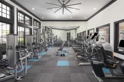 24 hour fitness center with cardio equipment and free weights