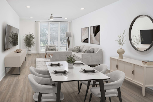 Townhome open-concept main floor living and dining with wood-style floors at Camden Belmont apartments in Dallas, TX