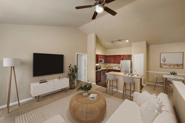 Living room, kitchen, and dining area with vaulted ceilings at Camden Brushy Creek apartments in Cedar Park, TX