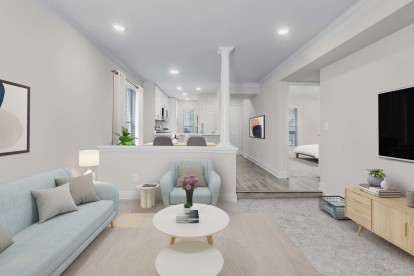 Modern living room and adjacent dining area with hardwood-style flooring at Camden Fairview in Charlotte, NC